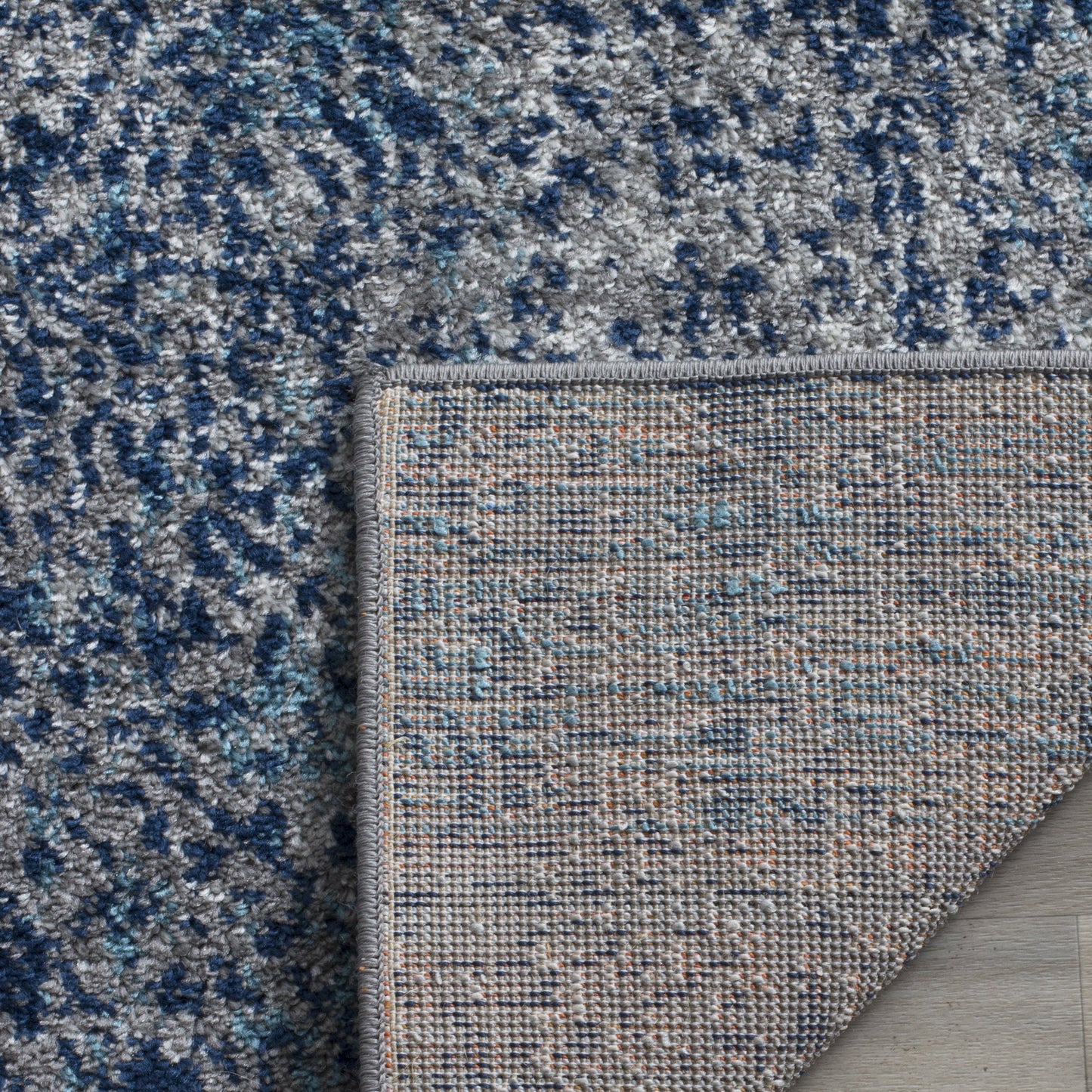 SAFAVIEH Madison Collection Area Rug - 6'7" x 9'2", Navy & Silver, Glam Ogee Trellis Distressed Design, Non-Shedding & Easy Care, Ideal for High Traffic Areas in Living Room, Bedroom (MAD604G)