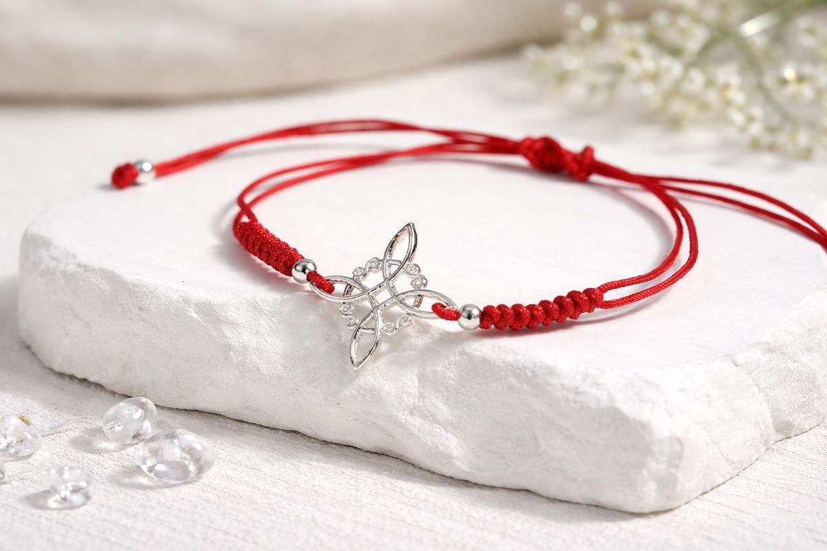 AeraVida Adjustable Red Witches Knot Bracelet with Sterling Silver Flower Charm – 19mm Symbol Centerpiece, Cotton Rope Band 6 to 9 Inches, Sliding Knot Closure