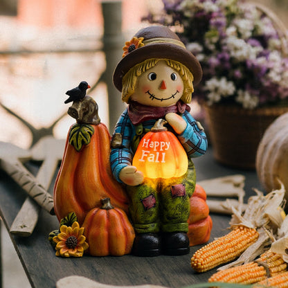 TERESA'S COLLECTIONS Fall Decor, Scarecrow Decor, Autumn Scarecrow Holding Pumpkin with Solar Lights, Waterproof Resin Outdoor Fall Decor, Fall Gifts Outdoor/Indoor,6.3"