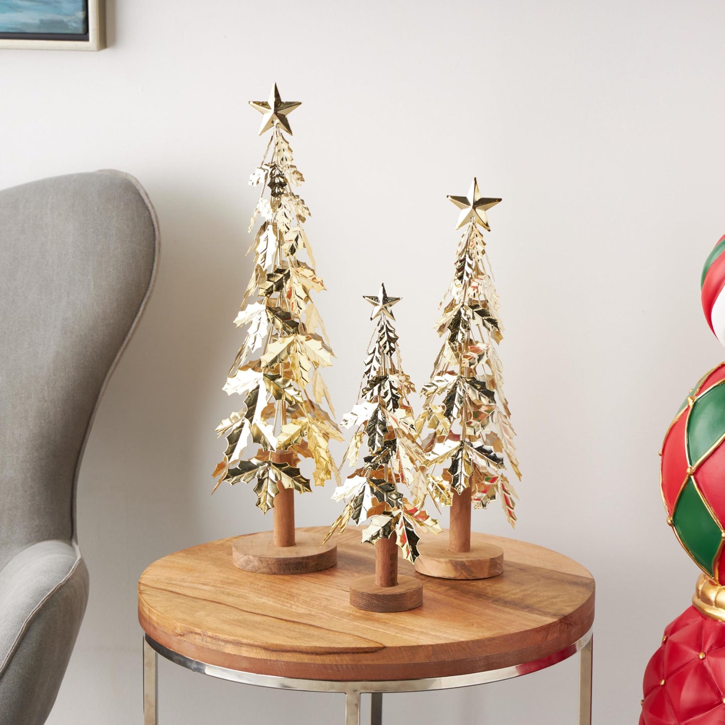 Deco 79 Metal Tree Decorative Sculpture Holiday Layered Holly Leaf Christmas Home Decor Statues with Wooden Base and Star Topper, Set of 3 Accent Figurines 22", 18", 14"H, Gold