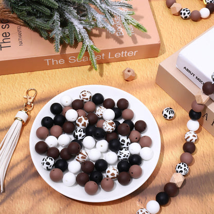 JarThenaAMCS 100Pcs Cow Print Silicone Beads Assorted Brown Black White Round Spacer Beads Keychain Making Kit with Elastic Rope Wood Key Rings and Tassels for DIY Crafts Jewelry Bracelet Pen