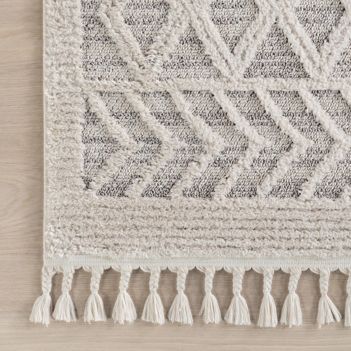 nuLOOM Oval 6'7" x 9' Ansley Moroccan Tassel Area Rug, Light Grey, High-Low Textured Bohemian Design, Plush High Pile, Stain Resistant, For Bedroom, Living Room, Hallway, Entryway
