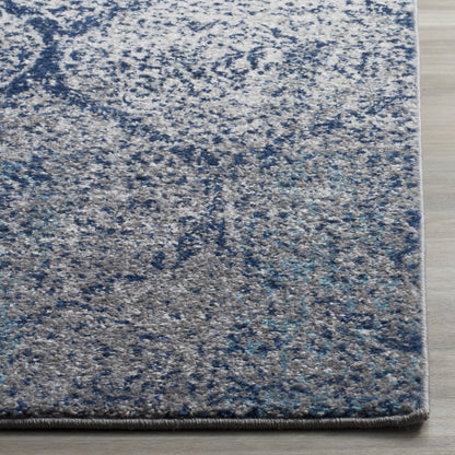 SAFAVIEH Madison Collection Area Rug - 6'7" x 9'2", Navy & Silver, Glam Ogee Trellis Distressed Design, Non-Shedding & Easy Care, Ideal for High Traffic Areas in Living Room, Bedroom (MAD604G)