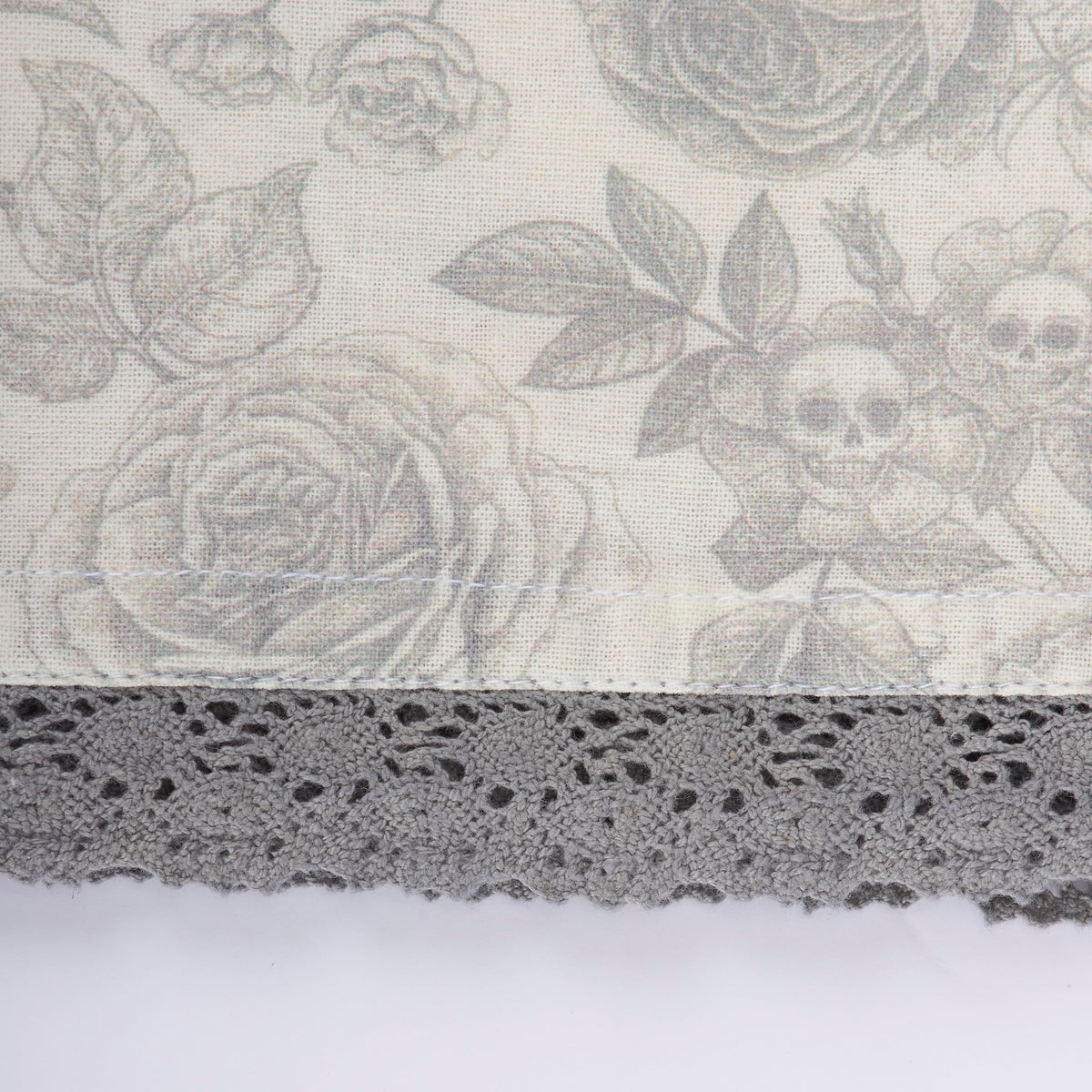 Primitives by Kathy Decorative Kitchen Towel, from Our Halloween Collection displays a Spooky Monochrome Pattern of Skull Flowers and Roses with a complementing Gray lace Trim
