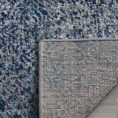SAFAVIEH Madison Collection Area Rug - 6'7" x 9'2", Navy & Silver, Glam Ogee Trellis Distressed Design, Non-Shedding & Easy Care, Ideal for High Traffic Areas in Living Room, Bedroom (MAD604G)